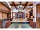 Gourmet kitchen with granite island, custom cabinetry, and high-end appliances at 7734 Still Lakes Dr, Odessa, FL 33556