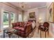 Charming bedroom with a comfortable sitting area and French doors at 7734 Still Lakes Dr, Odessa, FL 33556