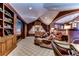 Home theater with comfortable seating and built-in shelving at 7734 Still Lakes Dr, Odessa, FL 33556
