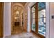 Bright hallway with French doors opening to a courtyard at 7734 Still Lakes Dr, Odessa, FL 33556