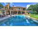 Large pool with a view of the home's exterior at 7734 Still Lakes Dr, Odessa, FL 33556