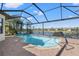 A screened-in pool has a brick paver deck with lovely waterfront views at 10111 Craftsman Park Way, Palmetto, FL 34221