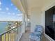 Beautiful balcony with seating and picturesque views of the surrounding water and landscape at 17745 Gulf Blvd # 604, Redington Shores, FL 33708