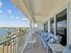 Spacious balcony with outdoor seating and a view of the water and surrounding area at 17745 Gulf Blvd # 604, Redington Shores, FL 33708