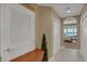 Open hallway with natural light flowing from the bedroom and serene water views at 17745 Gulf Blvd # 604, Redington Shores, FL 33708