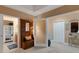 Comfortable hallway features stylish hall tree and glimpses into adjacent rooms at 17745 Gulf Blvd # 604, Redington Shores, FL 33708