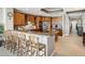 Gourmet kitchen with wood cabinets, center island, granite countertops, and stainless steel appliances at 17745 Gulf Blvd # 604, Redington Shores, FL 33708