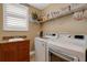 Functional laundry room featuring modern washer and dryer units and lots of storage at 17745 Gulf Blvd # 604, Redington Shores, FL 33708