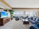 Open living room with water views, light carpet, and comfortable seating at 17745 Gulf Blvd # 604, Redington Shores, FL 33708