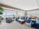 Open living room with water views, light carpet, and comfortable seating at 17745 Gulf Blvd # 604, Redington Shores, FL 33708