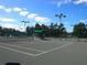 Well-lit tennis courts with ample space for play at 18833 Bent Pine Dr, Hudson, FL 34667