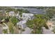 Aerial view of a luxurious home with lush landscaping and stunning lake views at 2905 Safe Harbor Dr, Tampa, FL 33618
