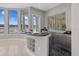 Wet bar with granite counters boasts water views from picture windows at 2905 Safe Harbor Dr, Tampa, FL 33618
