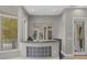 This wet bar features modern cabinetry, a granite countertop, and glass block accents at 2905 Safe Harbor Dr, Tampa, FL 33618