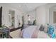 Comfortable bedroom with ensuite access and bright lighting and modern fixtures at 2905 Safe Harbor Dr, Tampa, FL 33618