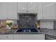 Granite countertops with smooth cooktop and wooden cabinets for a modern kitchen finish at 2905 Safe Harbor Dr, Tampa, FL 33618