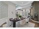 Elegant dining room featuring sleek table setting, unique wall tiles, and glass block window at 2905 Safe Harbor Dr, Tampa, FL 33618