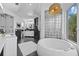 Elegant bathroom featuring a free-standing tub and glass block accents at 2905 Safe Harbor Dr, Tampa, FL 33618