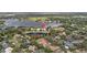Bird's eye view of house and surrounding neighborhood near a lake at 2905 Safe Harbor Dr, Tampa, FL 33618