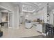 Spacious kitchen with large island, stainless steel appliances, luxury countertops and tiled floors at 2905 Safe Harbor Dr, Tampa, FL 33618