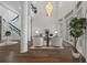 Open living room with hardwood floors, elegant staircase, large windows, and stylish decor at 2905 Safe Harbor Dr, Tampa, FL 33618