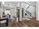 Spacious living room with hardwood floors, soaring ceilings, and glass block accents near the staircase at 2905 Safe Harbor Dr, Tampa, FL 33618