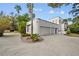 Modern home with attached two-car garage and paver driveway at 2905 Safe Harbor Dr, Tampa, FL 33618
