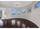 Round bedroom with dark hardwood floors and water views at 2905 Safe Harbor Dr, Tampa, FL 33618