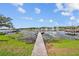Private wooden dock extending into calm lake waters at 2905 Safe Harbor Dr, Tampa, FL 33618