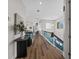 Bright hallway with hardwood floors and glass railings at 2905 Safe Harbor Dr, Tampa, FL 33618