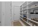 Well-organized pantry with white shelving provides ample storage space at 2905 Safe Harbor Dr, Tampa, FL 33618