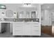 Modern bathroom with a large vanity, mirrored medicine cabinet, and stylish fixtures at 2905 Safe Harbor Dr, Tampa, FL 33618