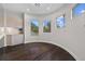 Spacious bonus room with dark hardwood floors and built-in cabinets at 2905 Safe Harbor Dr, Tampa, FL 33618