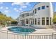 Luxury home exterior with pool and lake view at 2905 Safe Harbor Dr, Tampa, FL 33618