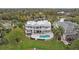 Luxury home with pool and lake view from above at 2905 Safe Harbor Dr, Tampa, FL 33618
