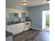 Renovated kitchen with white shaker cabinets and granite countertops at 3751 67Th N Ave, Pinellas Park, FL 33781