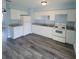 White kitchen cabinets, granite countertops, and modern appliances at 3751 67Th N Ave, Pinellas Park, FL 33781