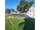 Asphalt parking lot with designated parking spaces and landscaping at 3751 67Th N Ave, Pinellas Park, FL 33781