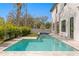 Beautiful backyard with a refreshing pool, spa, patio and manicured landscaping at 3914 W Angeles St, Tampa, FL 33629