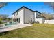 Exterior view of home featuring a pool, covered patio, and well-maintained backyard at 3914 W Angeles St, Tampa, FL 33629