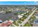 Serene aerial view of a waterfront community with lush landscapes, private docks, and boats dotting the tranquil canals at 7949 2Nd S Ave, St Petersburg, FL 33707