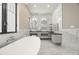 This spacious bathroom features a soaking tub, double sinks, and natural light at 7949 2Nd S Ave, St Petersburg, FL 33707