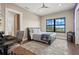 Comfortable bedroom with ceiling fan, sleek furniture and a large window showcasing beautiful water views at 7949 2Nd S Ave, St Petersburg, FL 33707