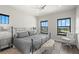 Bedroom with waterfront views and elegant furnishings including an iron bed frame at 7949 2Nd S Ave, St Petersburg, FL 33707