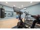 This home gym has an assortment of exercise equipment, including a Peleton bike at 7949 2Nd S Ave, St Petersburg, FL 33707