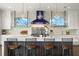 Chef's kitchen features a large center island with seating and professional-grade stainless steel appliances at 7949 2Nd S Ave, St Petersburg, FL 33707