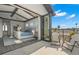 A spacious main bedroom with dark wood floors opens up to a balcony overlooking the neighborhood at 7949 2Nd S Ave, St Petersburg, FL 33707