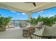 A relaxing outdoor patio offers seating, green foliage and views of the water at 7949 2Nd S Ave, St Petersburg, FL 33707