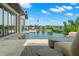 Gorgeous infinity pool with stepping stones, offering stunning waterfront views and lush landscaping at 7949 2Nd S Ave, St Petersburg, FL 33707
