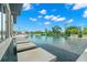 Luxury pool featuring stepping stones and waterfront views overlooking the harbor with a blue sky above at 7949 2Nd S Ave, St Petersburg, FL 33707